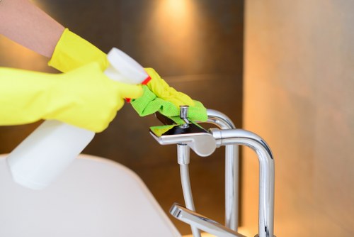 Cleaner using professional equipment in a safe carpet cleaning setting